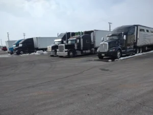 Semi trucks parked at secure outdoor truck parking lot in York, PA