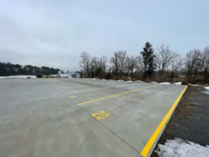 Truck parking spaces at Premium Parking & Storage, 225 Hanover Road, York, PA 17408, featuring wide concrete pads with clearly marked numbered spots for tractor trailers and commercial trucks.