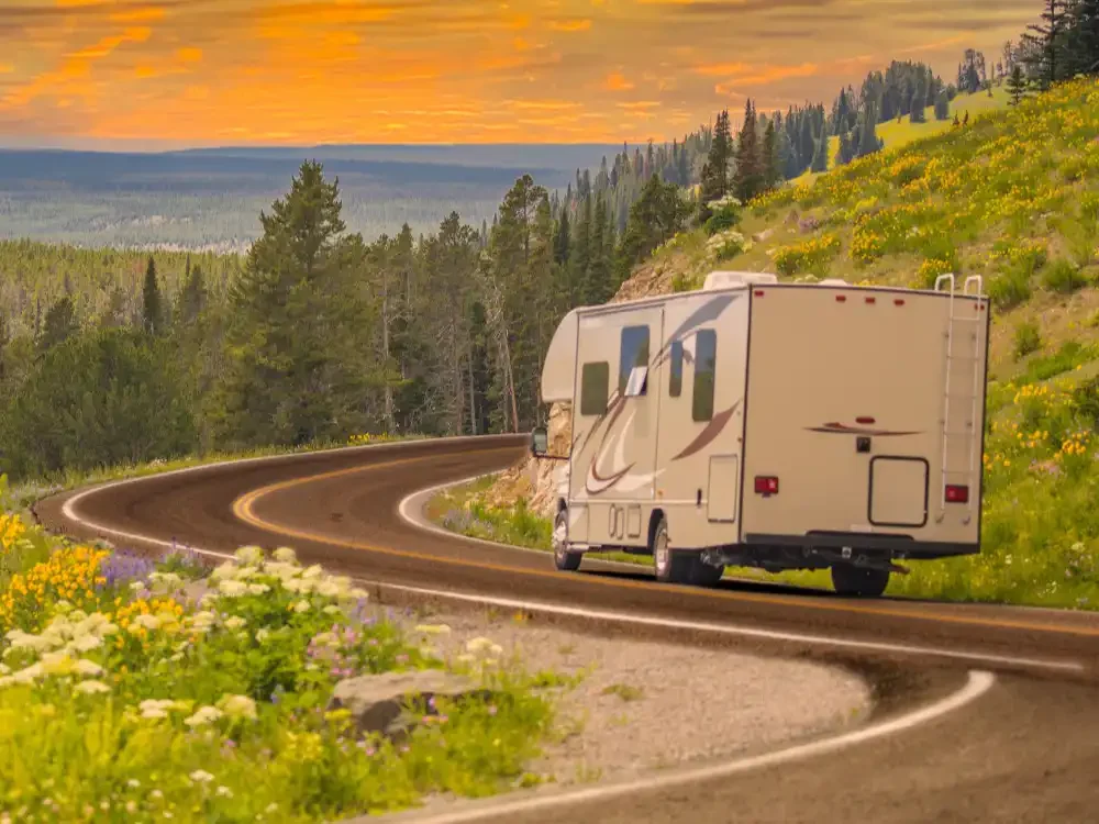 RV Camper driving on open highway